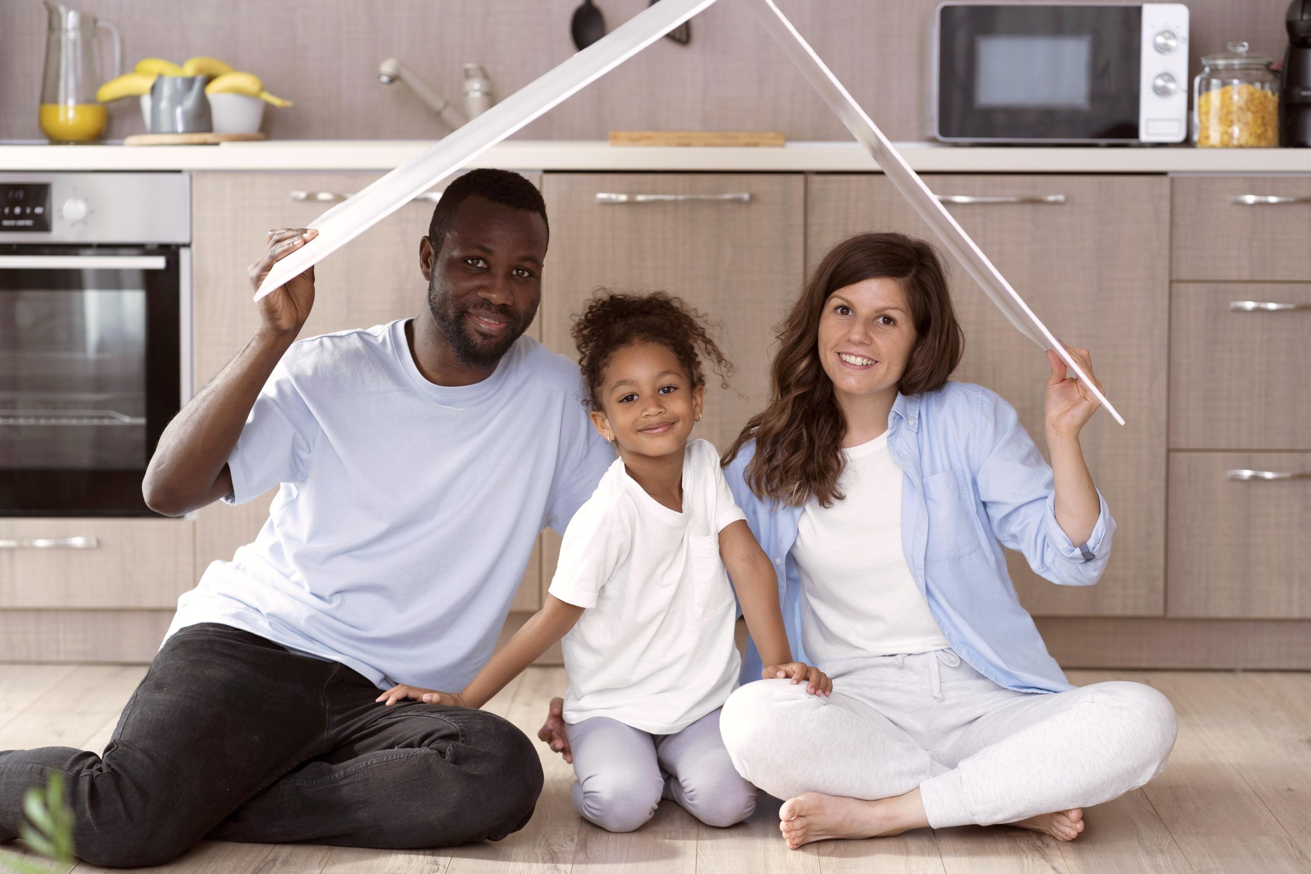 cute family holding roof their head
